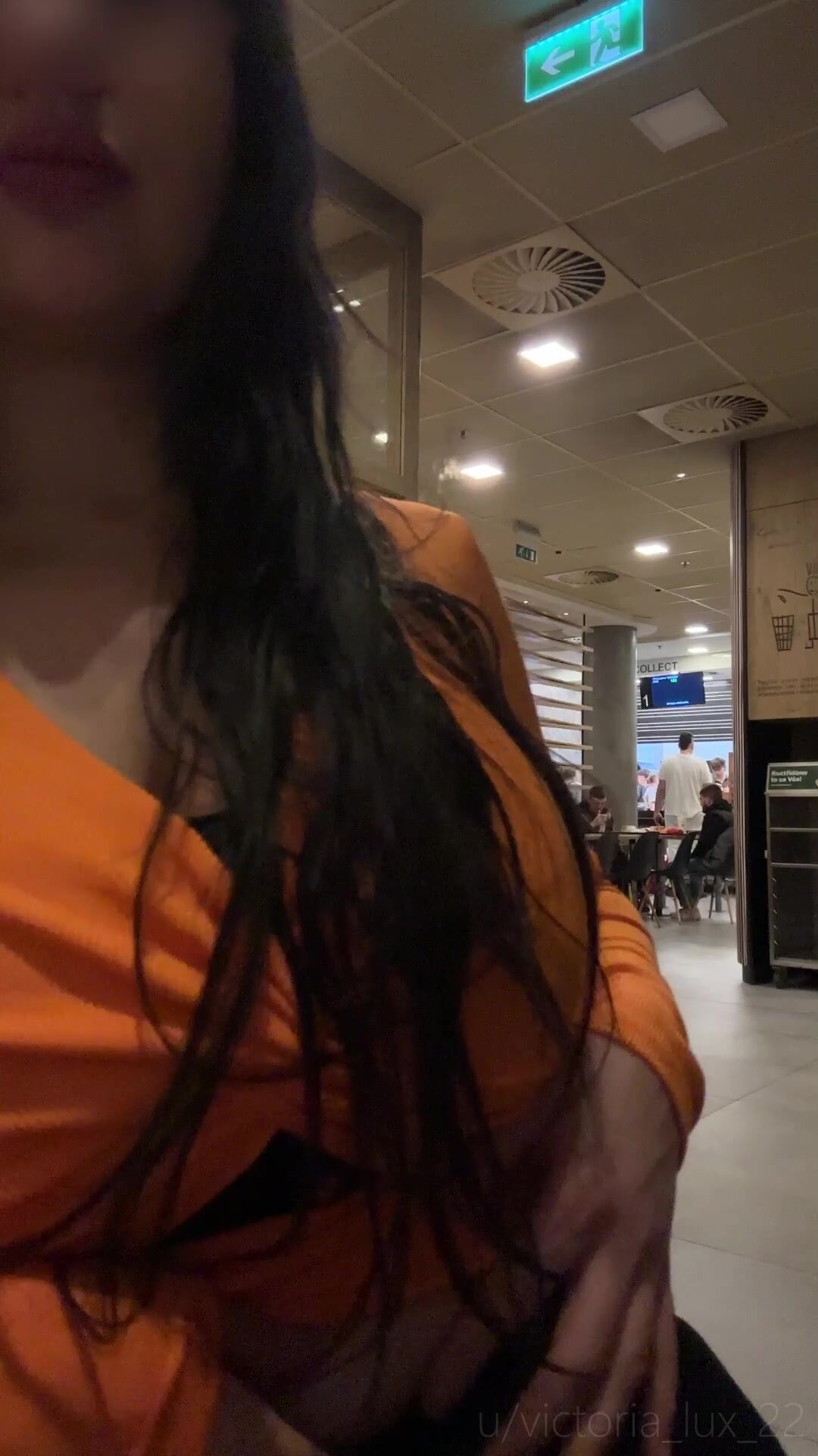 Playing with my tits in the McDonald's until my meal is ready.