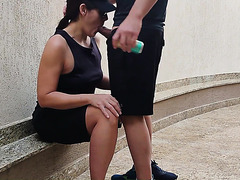 Brunette girl wearing sunglasses gives her boyfriend a nice blowjob