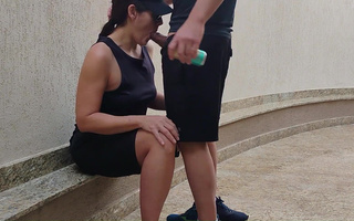 Brunette girl wearing sunglasses gives her boyfriend a nice blowjob