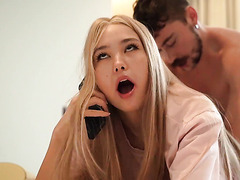 Asian cutie talks with her mom on the phone to calm her down while getting fucked by a friend