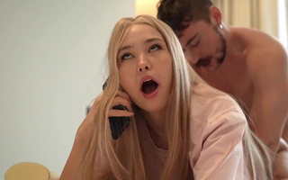 Asian cutie talks with her mom on the phone to calm her down while getting fucked by a friend