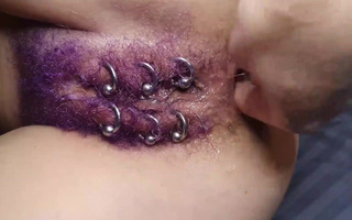 Painful fisting of a pierced pussy with a huge purple bush